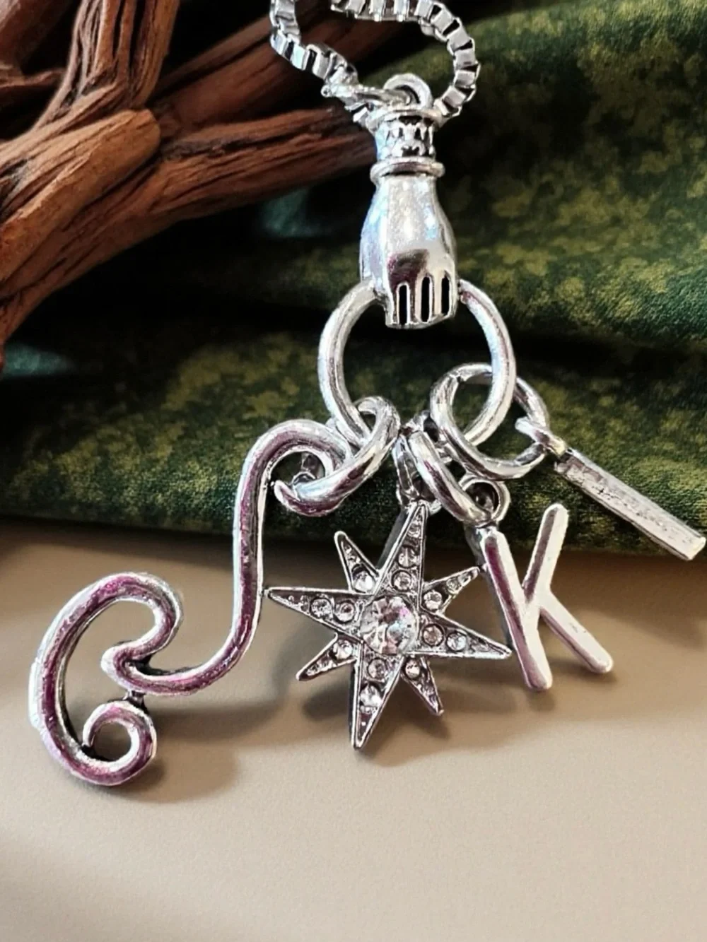 Monk DND necklace with the wind, a star, and KI Dungeons and Dragons jewelry